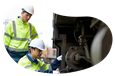 Railroad contractors working on a train.