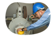 A utility contactor maintains a piece of equipment.