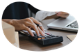 A small business owner calculating their inland marine insurance costs