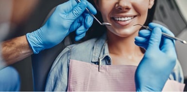 A closeup of a woman's smile at the dentist.