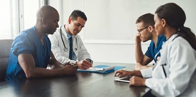 Medical team having a meeting about HIPAA security compliance.