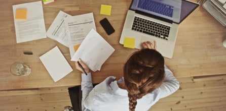 Overhead view of a woman working on a computer