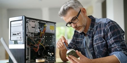 A technician repairing a desktop computer