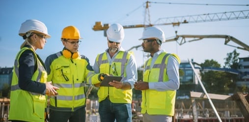 General contractors discussing on job site