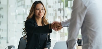 Small business owners shaking hands