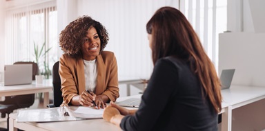 A small business owner meeting with a prospective new client.