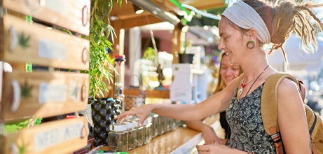 Woman browsing a cannabis dispensary's marijuana products