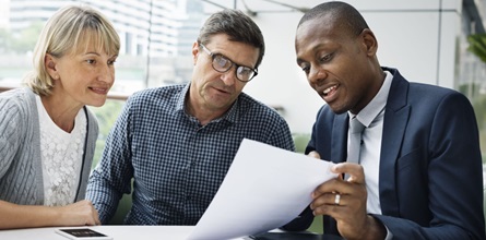 Insurance agent discussing licenses with customers