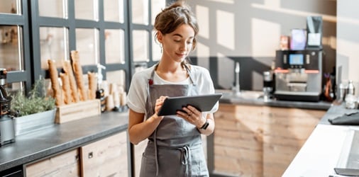 Self-employed business owner looking at business details.