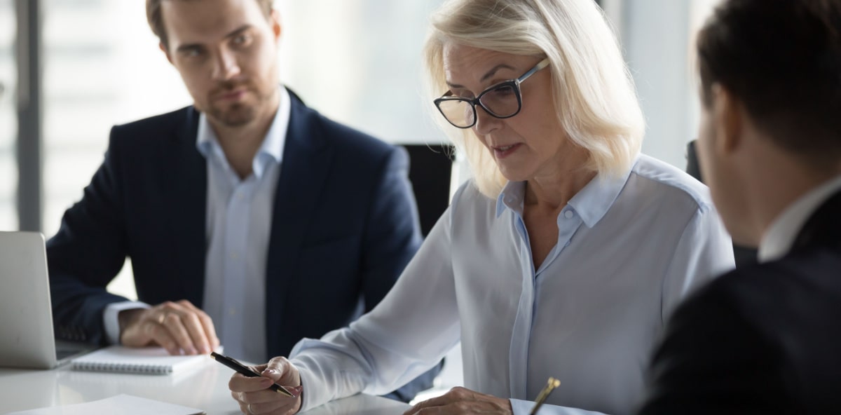 Person signing insurance and bonding documents.