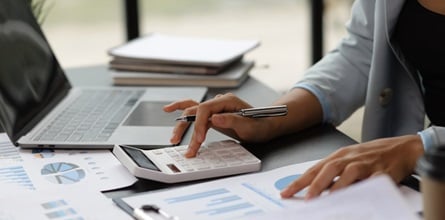 Bookkeeper in their office calculating a client's finances