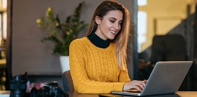 A gig worker planning on her laptop.