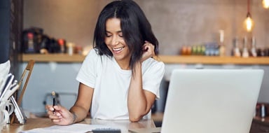 Small business owner working on a laptop.