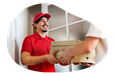 A delivery driver hands several boxes of pizza to a customer.