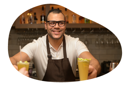 A mobile bartender hands drinks to customers. A mobile bartender hands drinks to customers.