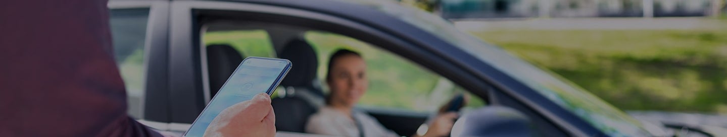 A rental car arrives for a customer. A rental car arrives for a customer.