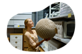 A Wayfair seller looks at a pouf ottoman in their warehouse.