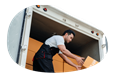 A driver unloads boxes from their box truck